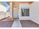 Inviting front porch with security door and well-kept landscaping, adding to the home's curb appeal at , Las Vegas, NV 89108