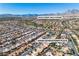 Extensive aerial perspective of 10408 Georgetown Place and the surrounding neighborhood near the Eagle Crest Golf Course at 10408 Georgetown Pl, Las Vegas, NV 89134