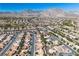Wide aerial shot showcasing the neighborhood layout with homes, streets, and mountain views in the background at 10408 Georgetown Pl, Las Vegas, NV 89134