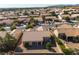 Bird's-eye view of the backyard showcasing desert landscape and nearby homes at 10408 Georgetown Pl, Las Vegas, NV 89134