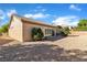 View of backyard with desert landscaping, block wall, and small patio at 10408 Georgetown Pl, Las Vegas, NV 89134