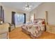 Cozy bedroom with a ceiling fan, comfortable bed, and dresser at 10408 Georgetown Pl, Las Vegas, NV 89134