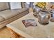 Elegant coffee table with decorative vases and magazines, adding a touch of sophistication at 10408 Georgetown Pl, Las Vegas, NV 89134