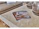 Close up shot of Decor magazines on coffee table in living room setting at 10408 Georgetown Pl, Las Vegas, NV 89134