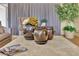 Cozy living room with decorative pottery, plants, and comfortable seating at 10408 Georgetown Pl, Las Vegas, NV 89134