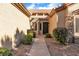 Inviting home entrance with a landscaped walkway and covered entryway at 10408 Georgetown Pl, Las Vegas, NV 89134