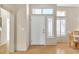 Bright entryway featuring a white front door with sidelight and clerestory window at 10408 Georgetown Pl, Las Vegas, NV 89134