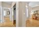 Hallway featuring hardwood floors, and a glimpse into the dining and living areas at 10408 Georgetown Pl, Las Vegas, NV 89134