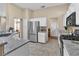 Bright kitchen with stainless steel refrigerator and granite countertops at 10408 Georgetown Pl, Las Vegas, NV 89134
