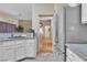 Open kitchen view with stainless steel refrigerator and access to other rooms at 10408 Georgetown Pl, Las Vegas, NV 89134