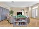 Cozy living room with hardwood floors and large windows, providing natural light at 10408 Georgetown Pl, Las Vegas, NV 89134