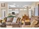 Open-concept living area with wood floors, a ceiling fan, and a view of the kitchen at 10408 Georgetown Pl, Las Vegas, NV 89134
