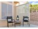 Cozy outdoor patio featuring modern seating and a privacy screen, perfect for relaxation at 10408 Georgetown Pl, Las Vegas, NV 89134