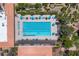 Aerial image highlighting the lap pool, umbrellas, lounge chairs, and lush landscaping at the community center at 10408 Georgetown Pl, Las Vegas, NV 89134