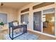 Bright sunroom featuring sliding glass doors, hardwood floors, and a modern desk at 10408 Georgetown Pl, Las Vegas, NV 89134