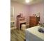 Cozy bedroom featuring a wooden desk and a matching chest of drawers at 11 Magnesium St, Henderson, NV 89015