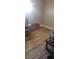 A vacant bedroom with wood-look flooring and grey walls at 11 Magnesium St, Henderson, NV 89015
