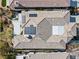 This aerial view showcases the roof of the home with solar panels and a backyard spa at 11321 Golden Chestnut Pl, Las Vegas, NV 89135