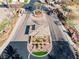 An aerial view of the community entrance with well-maintained landscaping and gated access at 11321 Golden Chestnut Pl, Las Vegas, NV 89135