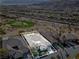 Aerial view highlighting the property's location on a golf course with mountain views at 11321 Golden Chestnut Pl, Las Vegas, NV 89135