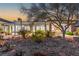 Beautiful backyard featuring desert landscaping, covered patio, and direct access into home at 11321 Golden Chestnut Pl, Las Vegas, NV 89135