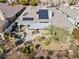An aerial view of the backyard featuring a pool, patio, and solar panels at 11321 Golden Chestnut Pl, Las Vegas, NV 89135