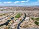 Picturesque aerial view of the Primary-planned community and golf course with lake feature at 11321 Golden Chestnut Pl, Las Vegas, NV 89135