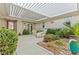 Cozy courtyard with comfortable seating and lush landscaping, creating a private and welcoming outdoor living space at 11321 Golden Chestnut Pl, Las Vegas, NV 89135