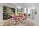 Bright dining area with access to the backyard, a decorative screen, and chandelier at 11321 Golden Chestnut Pl, Las Vegas, NV 89135