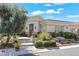 Charming front entrance with desert landscaping, walkway, and beautiful architectural detail at 11321 Golden Chestnut Pl, Las Vegas, NV 89135