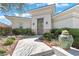 Inviting front entrance featuring well-manicured desert landscaping and an ornate front door at 11321 Golden Chestnut Pl, Las Vegas, NV 89135