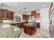 Beautiful kitchen with wood cabinets, granite countertops, and stainless steel appliances at 11321 Golden Chestnut Pl, Las Vegas, NV 89135