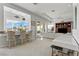 Bright living area with wet bar, breakfast bar and sliding door to exterior at 11321 Golden Chestnut Pl, Las Vegas, NV 89135