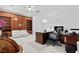 This home office features custom built-ins, a sleek desk, and a cozy seating area, perfect for productivity and relaxation at 11321 Golden Chestnut Pl, Las Vegas, NV 89135