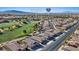 Scenic aerial view of the neighborhood with views of the golf course, lake, and easy access to the Interstate at 1269 Olivia Pkwy, Henderson, NV 89011