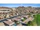 Panoramic aerial view showcasing the community, golf course, and the surrounding mountain landscape at 1269 Olivia Pkwy, Henderson, NV 89011