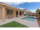 Well-maintained backyard featuring a sparkling swimming pool, patio area, and ample space for outdoor enjoyment at 1269 Olivia Pkwy, Henderson, NV 89011