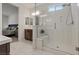 Bright bathroom with large glass shower featuring built-in seat and dual vanity at 1269 Olivia Pkwy, Henderson, NV 89011