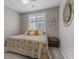 Cozy bedroom featuring a bed with colorful decorative pillows and accents and a gray carpet at 1269 Olivia Pkwy, Henderson, NV 89011
