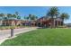 Elegant community clubhouse with lush landscaping, a well-manicured lawn, and ample parking at 1269 Olivia Pkwy, Henderson, NV 89011