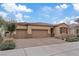 Beautiful single-story home featuring a three-car garage, desert landscaping and a tile roof at 1269 Olivia Pkwy, Henderson, NV 89011