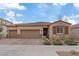 Charming single-story home featuring a three-car garage, desert landscaping and a tile roof at 1269 Olivia Pkwy, Henderson, NV 89011