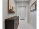 Bright hallway featuring tiled floors, neutral paint and decorative wall art at 1269 Olivia Pkwy, Henderson, NV 89011