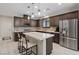 Modern kitchen featuring stainless steel appliances, a center island, and pendant lighting at 1269 Olivia Pkwy, Henderson, NV 89011