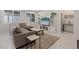 Comfortable living room featuring tile floors, a large sectional sofa, and a built-in media center at 1269 Olivia Pkwy, Henderson, NV 89011