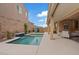 Backyard showcasing the pool and spa, the covered patio and outdoor seating area for entertainment at 1269 Olivia Pkwy, Henderson, NV 89011