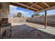 Backyard featuring desert landscaping, brick walls and a covered patio at 1413 Culley St, Las Vegas, NV 89110