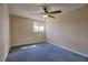 Bedroom featuring neutral walls, blue carpeting, and a window allowing natural light at 1413 Culley St, Las Vegas, NV 89110