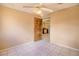 Bedroom with neutral walls, tile flooring, and an open doorway to kitchen at 1413 Culley St, Las Vegas, NV 89110