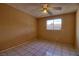 Bedroom with neutral walls, tile flooring, and a window at 1413 Culley St, Las Vegas, NV 89110